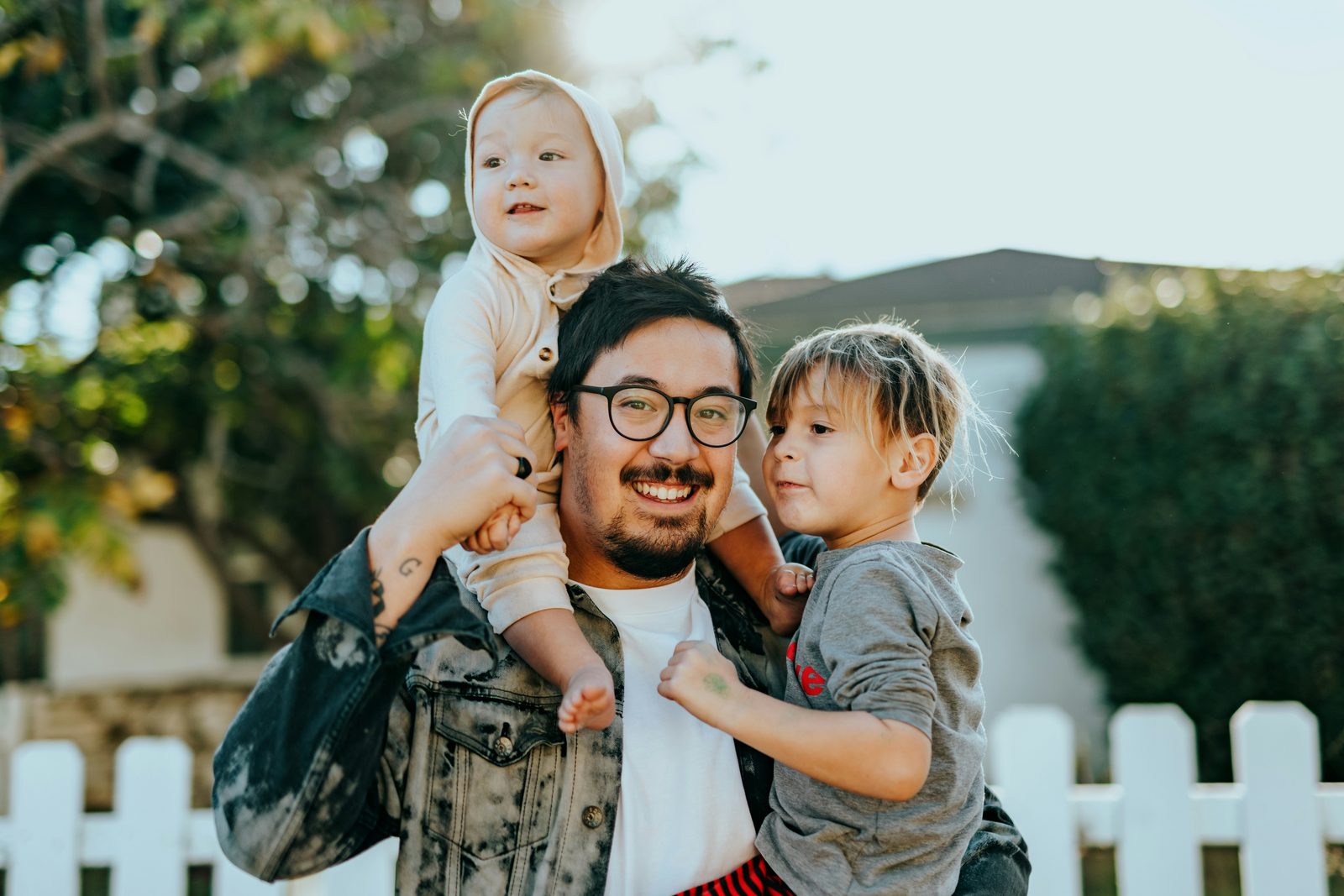 Father with his two young children — protecting what matters most