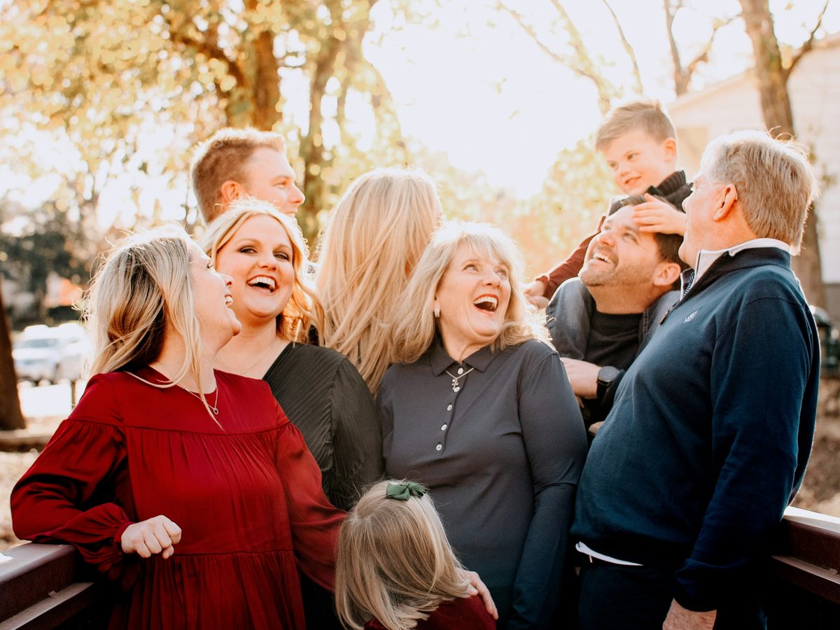 Multigenerational family together at golden hour — what you've built worth protecting