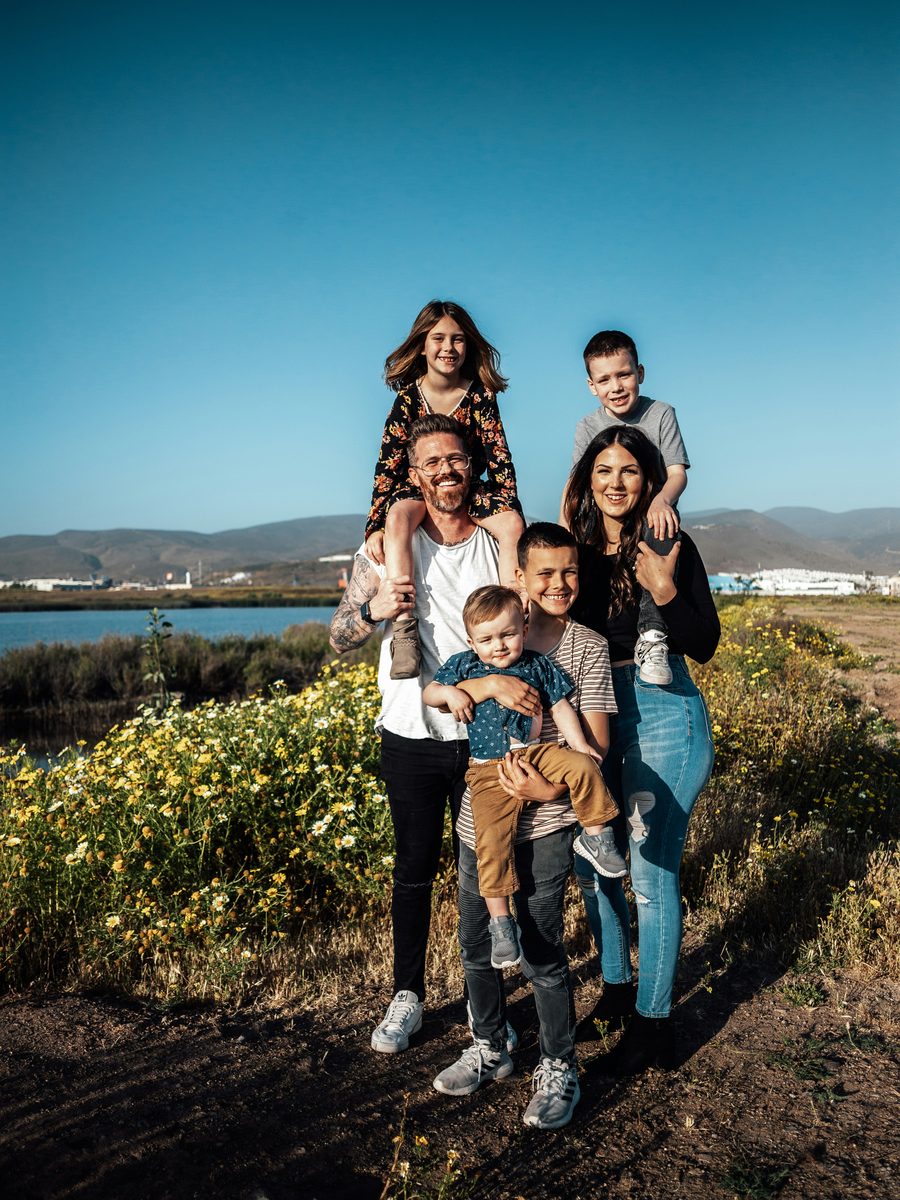 Family with children outdoors at golden hour — building a future worth protecting