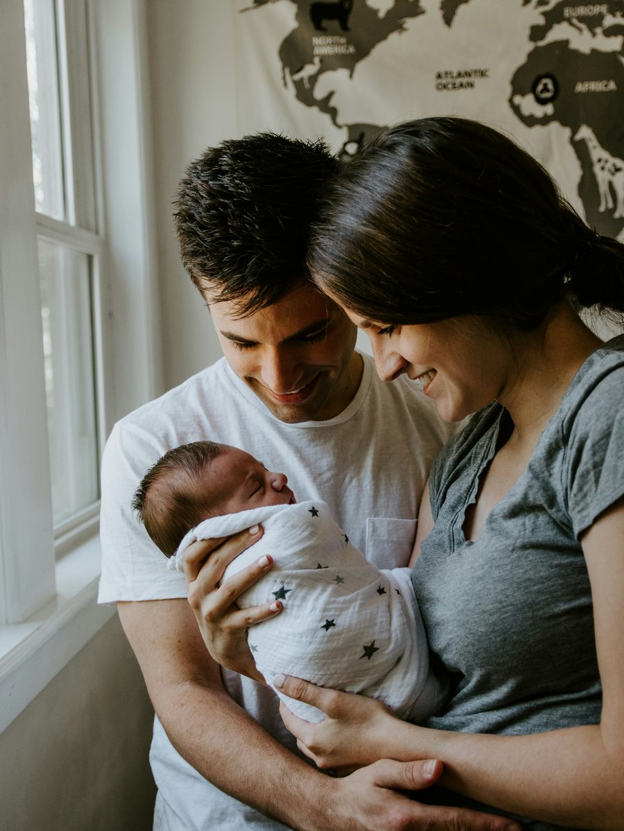 New parents with their newborn baby — protecting what matters most